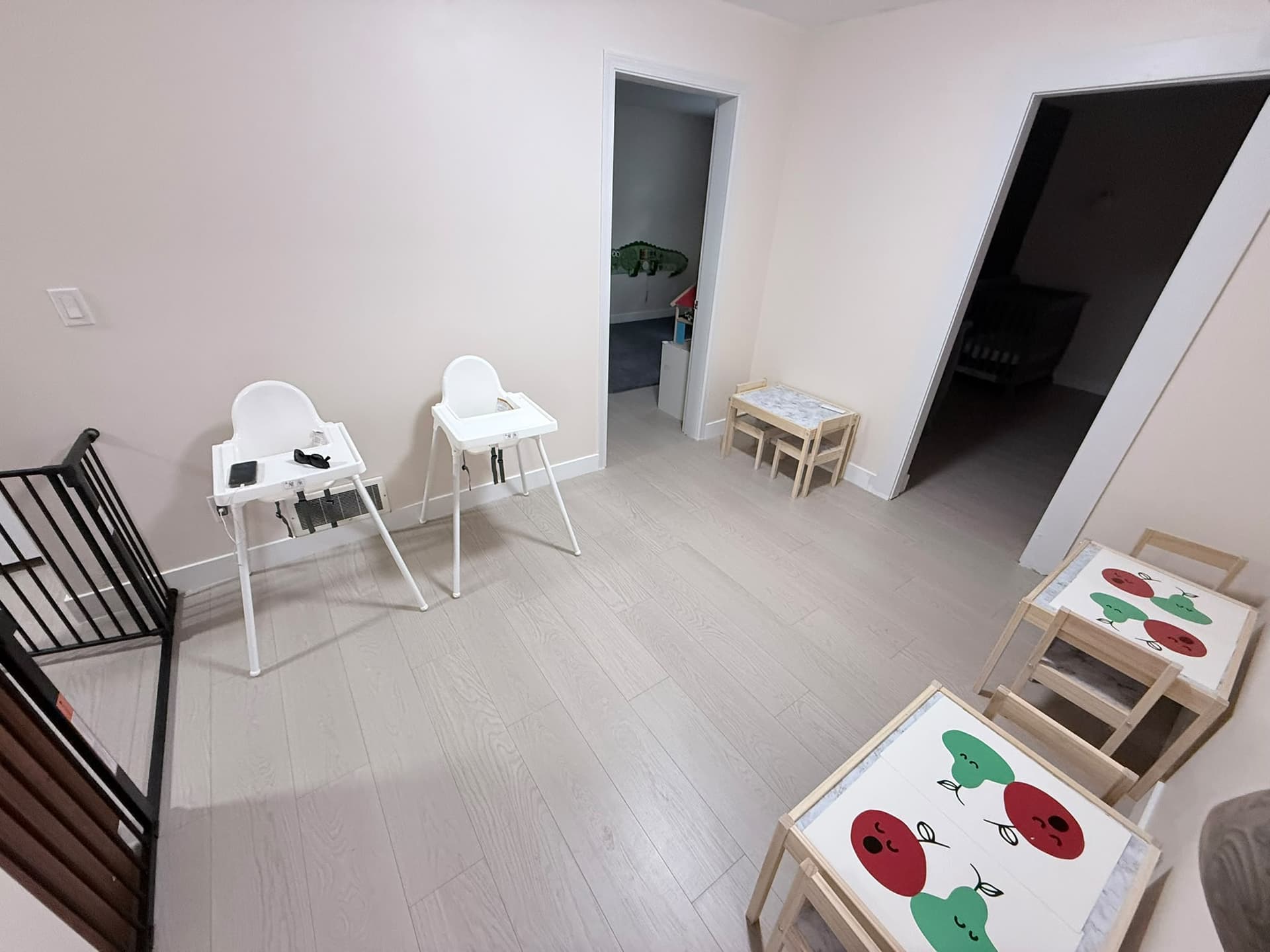 Kitchen and eating area with tables and chairs