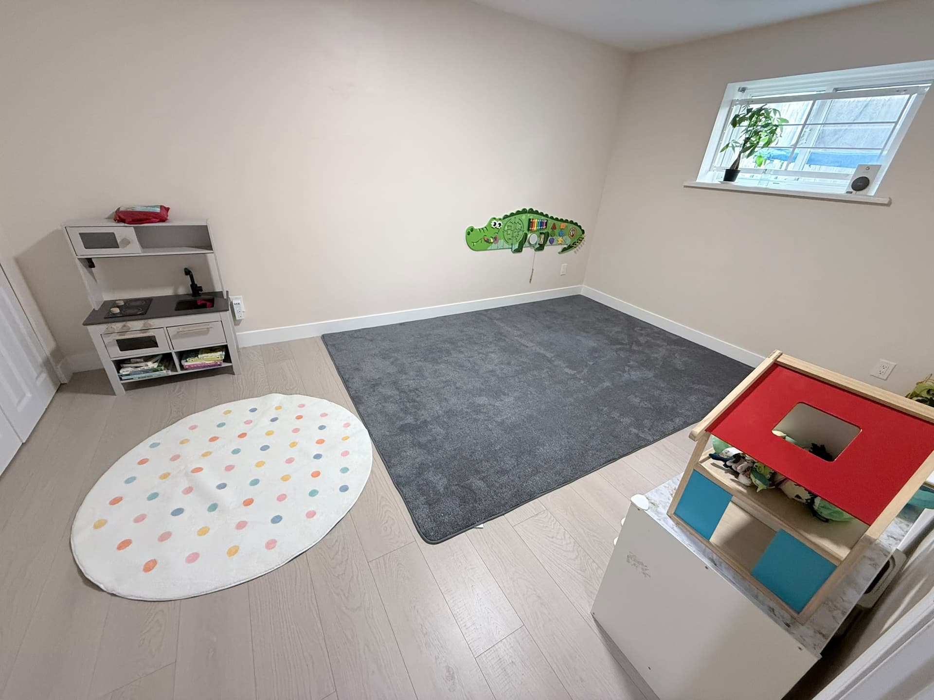 Playroom with toys and play mats