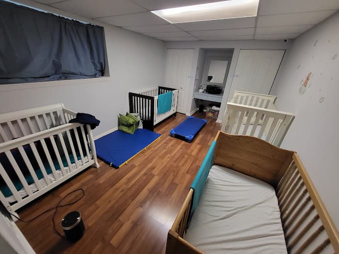 Nap room with cribs and sleeping mats