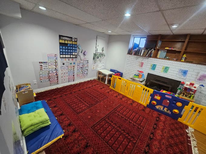 Activity area with a learning calendar and play mats